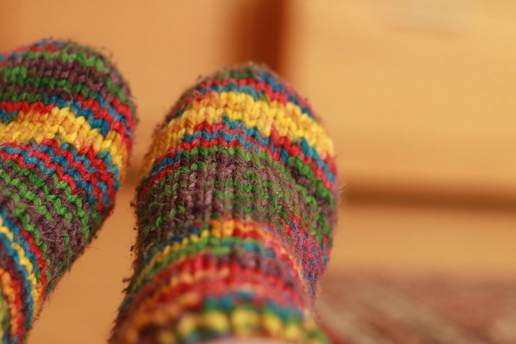 A pair of colourful hand-knitted socks